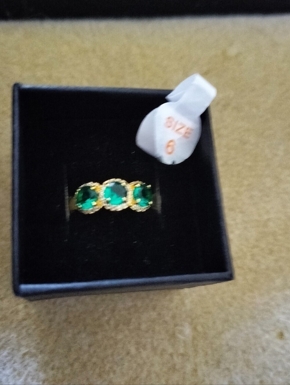 Emerald Green Oval Three-Stone Ring, Gold Tone Halo Setting, Size 6